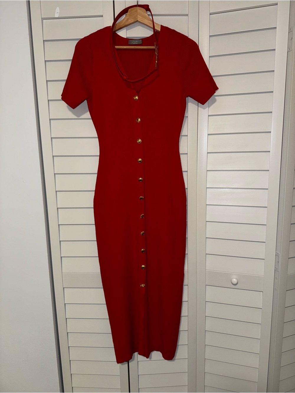 Knitted midi dress with buttons at the front and matching belt